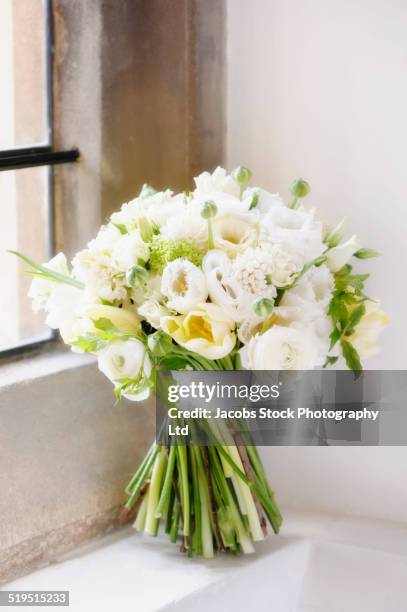 close up of bouquet of roses on window sill - rose ceremony stock pictures, royalty-free photos & images