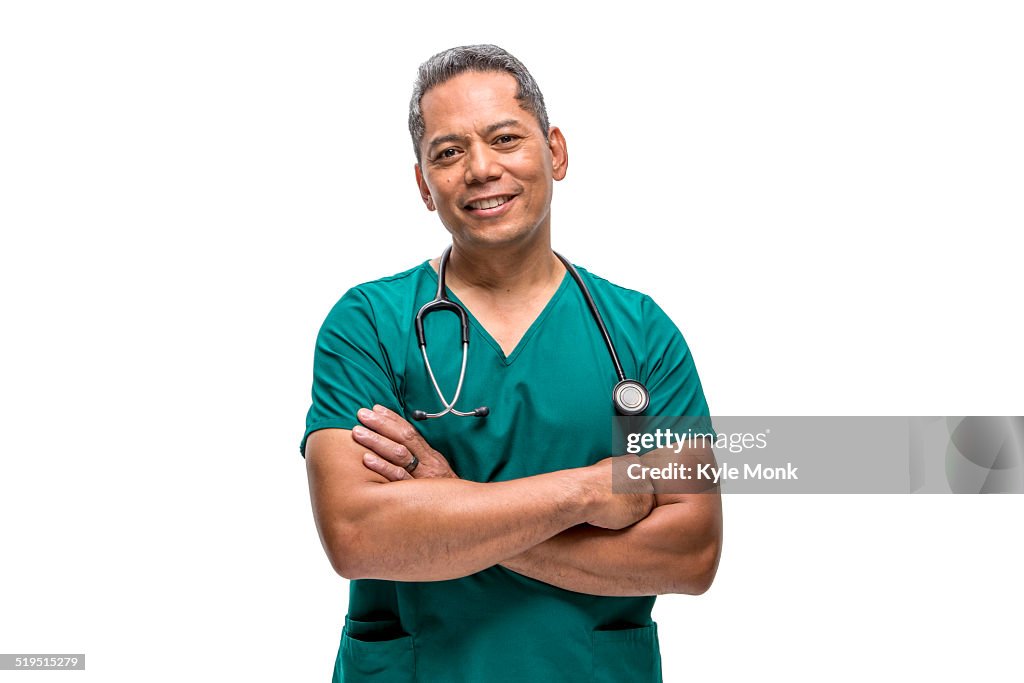 Pacific Islander nurse standing with arms crossed