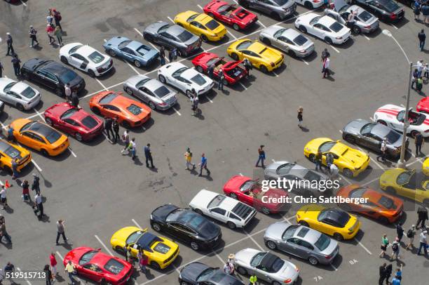 aerial view of people walking in parking lot - car show stock pictures, royalty-free photos & images