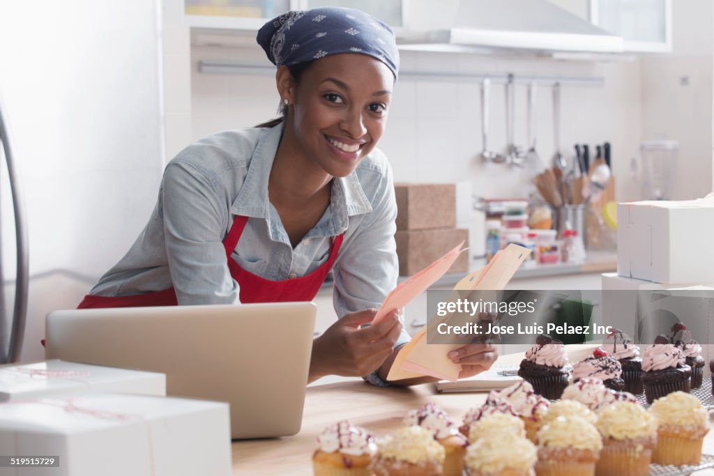 Mixed race baker working in commercial kitchen