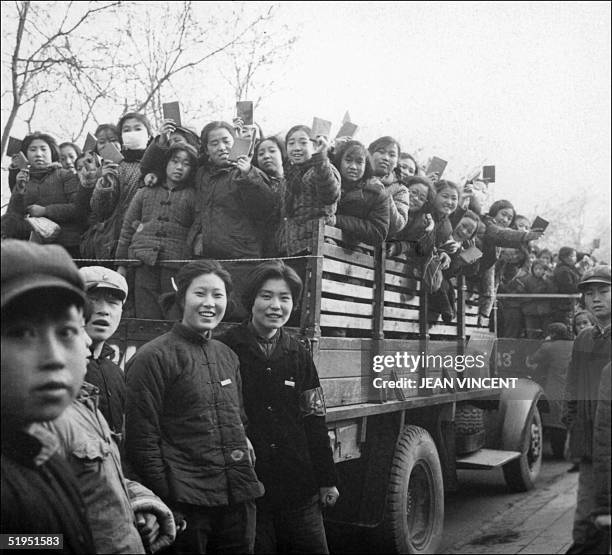 The propaganda squad of Red Guards, high school and university students, brandishing the copies of Chairman Mao Zedong's "Little Red Book," parade in...