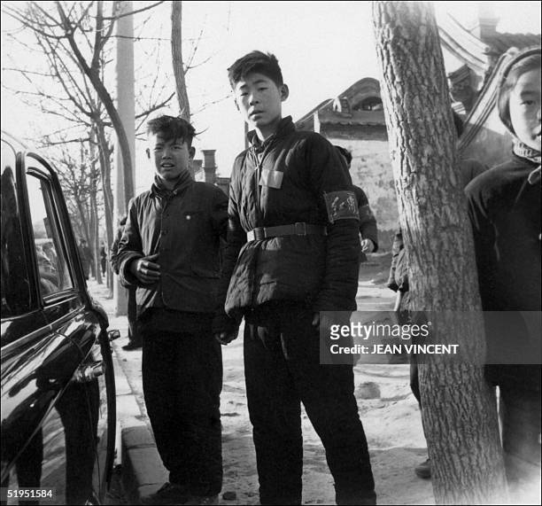 Young members of Red Guards, high school and university students, patrol in late 1966 in Beijing's streets to spread Mao's thought during the Great...