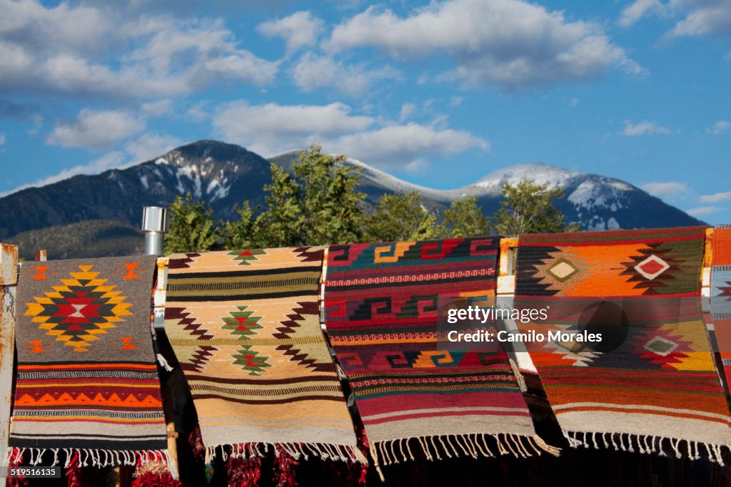 Multicolor blankets hanging near mountain
