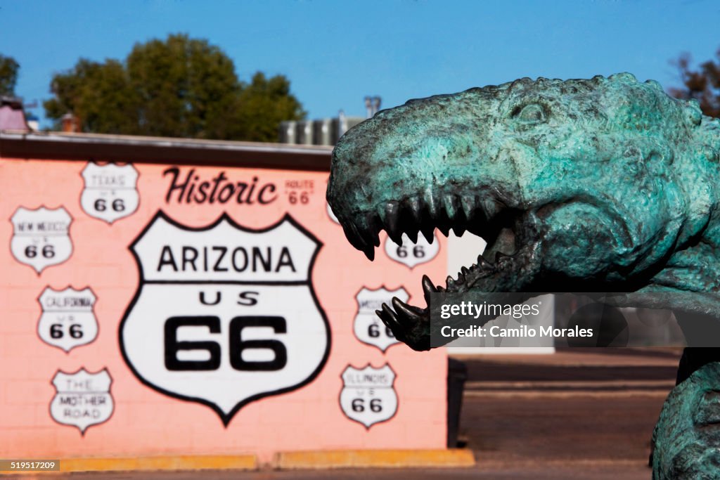 Close up of dinosaur statue by Historic Route 66 sign, Holbrook, Arizona, United States