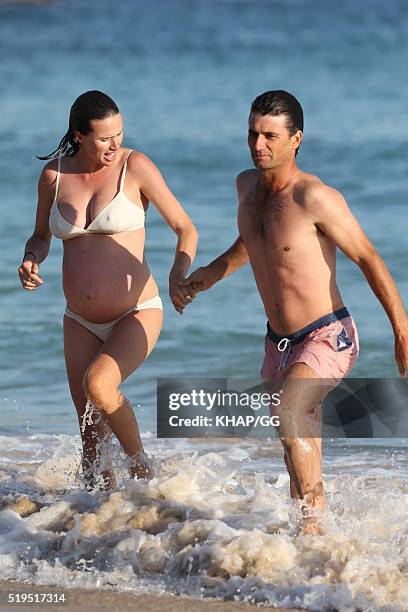 Heavily pregnant Francesca Cumani and husband Rob Archibald enjoy a day at the beach on April 6, 2016 in Sydney, Australia.