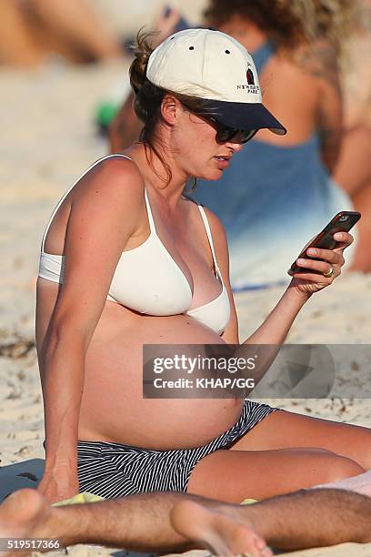 Heavily pregnant Francesca Cumani and husband Rob Archibald enjoy a day at the beach on April 6, 2016 in Sydney, Australia.