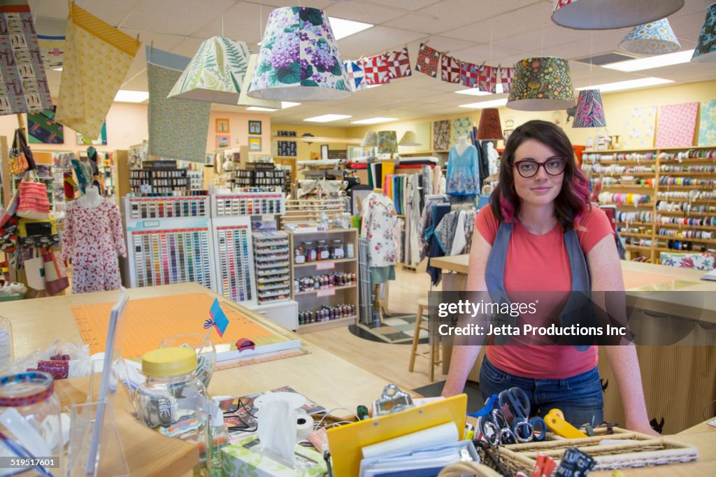 Clerk smiling in fabric store