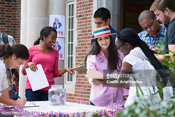 student campaigning at voter registration - political rally stock pictures, royalty-free photos & images