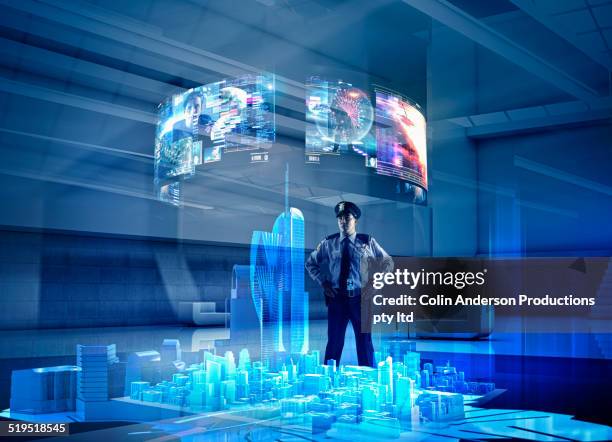 security guard watching virtual screens over city - hologram stockfoto's en -beelden