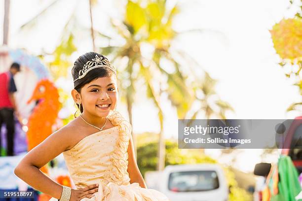 hispanic girl posing in ornate dress and tiara - beauty pageant crown stock-fotos und bilder