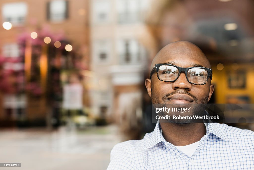 Black man looking out window