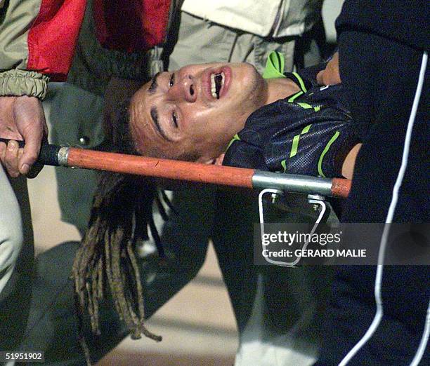 Scot Henrik Larsson is evacuated on a stretcher after breaking his leg in a UEFA Cup match beteen the Glasgow Celtics and Olympic of Lyons in Gerland...