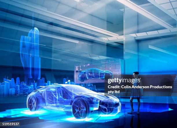 caucasian woman examining hologram of car - digital transportation stock pictures, royalty-free photos & images