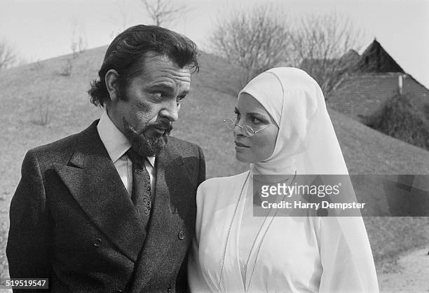 Richard Burton and Raquel Welch in costume during the filming of 'Bluebeard', directed by Edward Dmytryk, 20th March 1972. Burton plays Baron von...