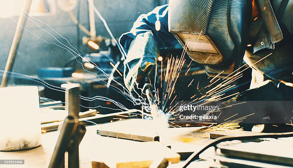 Welding two pieces of metal.