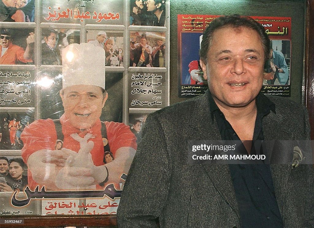 Egyptian actor Mahmoud Abdel Aziz poses in front o