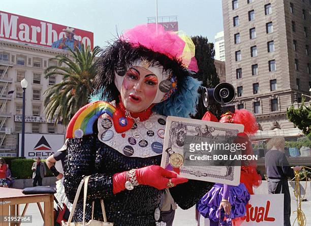 Sister Sadie Sadie, the Rabbi Lady, a gay rights activist and member of the "Sisters of Perpetual Indulgence", holds a "Papal Bond" during a protest...