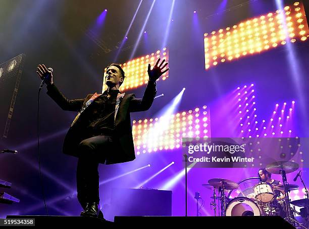 Musicians Brandon Flowers and Ronnie Vannucci, Jr. Of The Killers perform onstage during the grand opening of T-Mobile Arena on April 6, 2016 in Las...