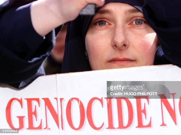 An anti-Putin protestor demonstrates in London against the Russian war in Chechnya 17 April 2000. The woman was one of approximately 150 protestors...