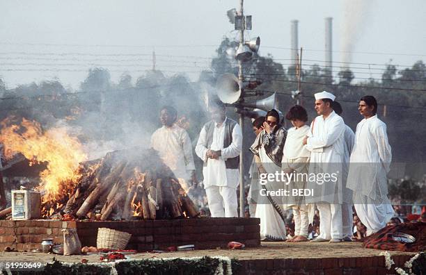 Indira Gandhi's son, Rajiv , his wife Sonia and their daughter Priyana watch the coffin of the slain Indian Prime Minister during the cremation...