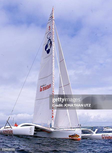 The 60-foot "Biscuits La Trinitaine" skippered by Marc Guillemot of France is underway shortly after the start of the TRANSAT singlehanded race off...