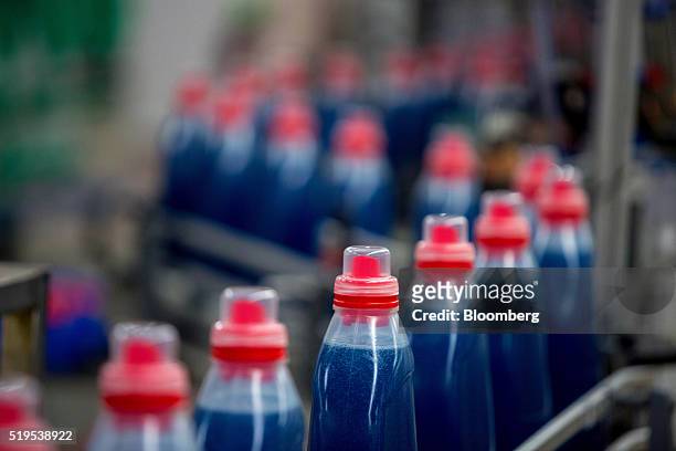 Bottles of Persil color gel laundry detergent move along the production line inside the Henkel AG factory in Duesseldorf, Germany, on Wednesday,...