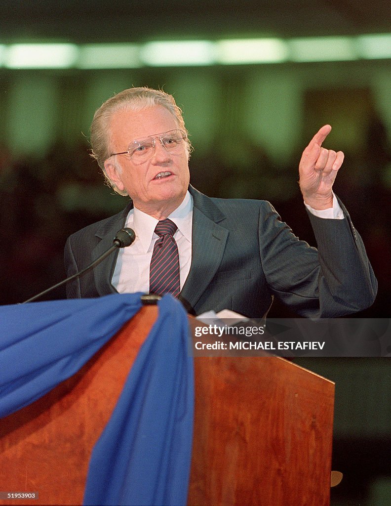 Billy Graham, the American evangelist, preaches 23