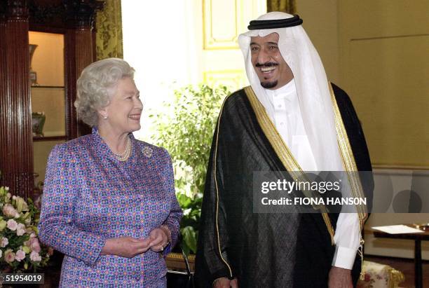 Britain's Queen Elizabeth II and Prince Salman bin Abdul Aziz of Saudi Arabia before going in to lunch at Buckingham Palace in London 28 June 2000.