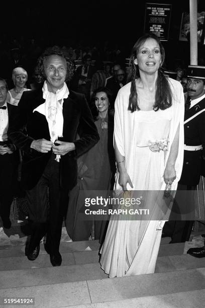 Swiss actress Marthe Keller and French actor Pierre Richard enter Festival Palace in Cannes 25 May 1977 during Cannes International Film Festival....