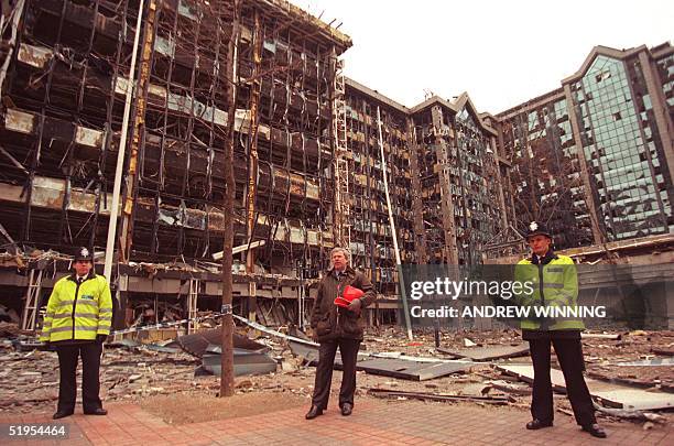 Picture taken 11 February 1996 shows Commander of the British Anti terorist Squad flanked by two uniform officers standing in front of the building...