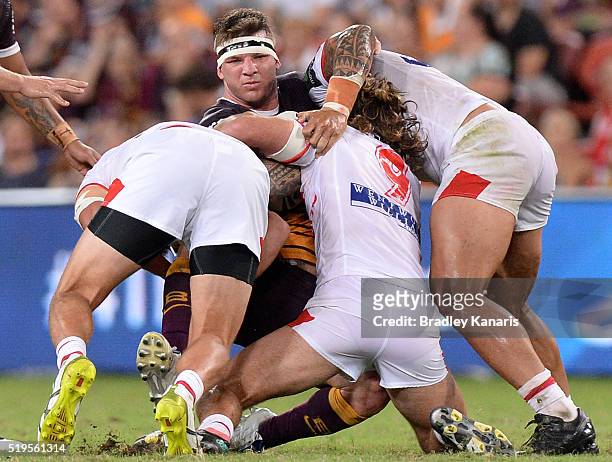 Josh McGuire of the Broncos is tackled during the round six NRL match between the Brisbane Broncos and the St George Illawarra Dragons at Suncorp...