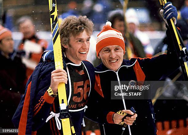 Nikolai Zimyatov and Vassili Rochev from the Soviet Union smile after the men's cross country 30km classical race, 14 February 1980 in Lake Placid at...