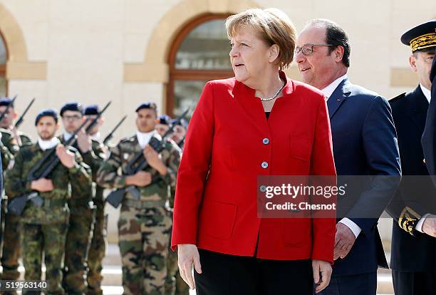 French President Francois Hollande and German Chancellor Angela Merkel arrive to attend the 18th French-German cabinet meeting on April 07, 2016 in...
