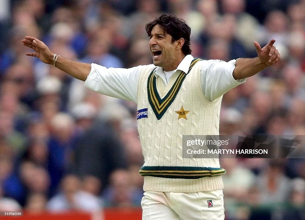 Pakistan`s bowler Wasim Akram celebrates the runou
