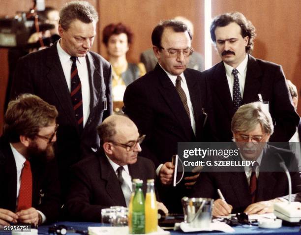 Czechoslovakian Foreign Minister Jiri Dienstbier signs 25 February 1991 in Budapest a document declaring the dissolution of the Warsaw Treaty...