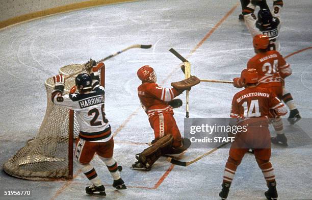 Hockey players John Harrington and Michael Ramsey react after the puck was fired into the net for a goal past Soviet goalkeeper Vladimir Myshkin as...