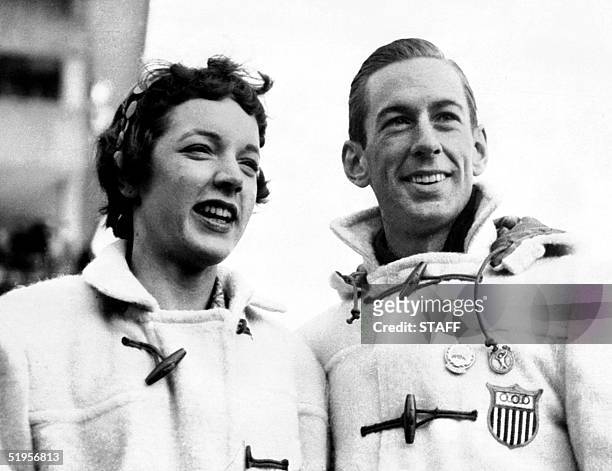 Figure skaters Tenley Albright and Hayes Alan Jenkins of the United States smile as they pose during the Winter Olympic Games 04 February 1956 in...