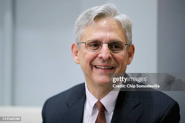 Supreme Court Justice nominee Merrick Garland talks with U.S. Sen. Heidi Heitkamp before a meeting in her office in the Hart Senate Office Building...