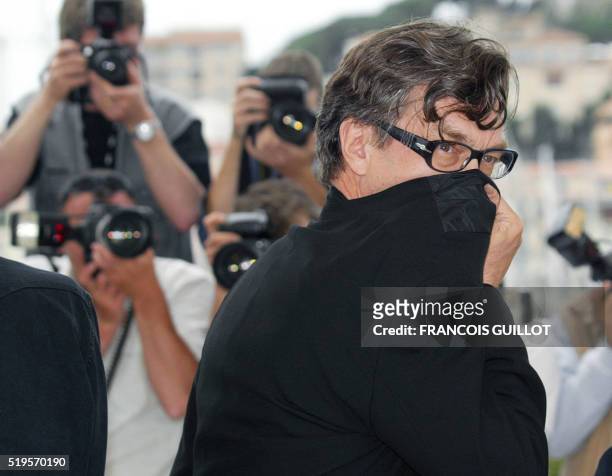 German director Wim Wenders jokes as he poses for photographers with some others directors during the photocall for their film 'Ten minutes older -...
