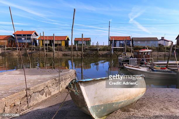 channel of la greve at la tremblade with oyster hut - oléron stock pictures, royalty-free photos & images