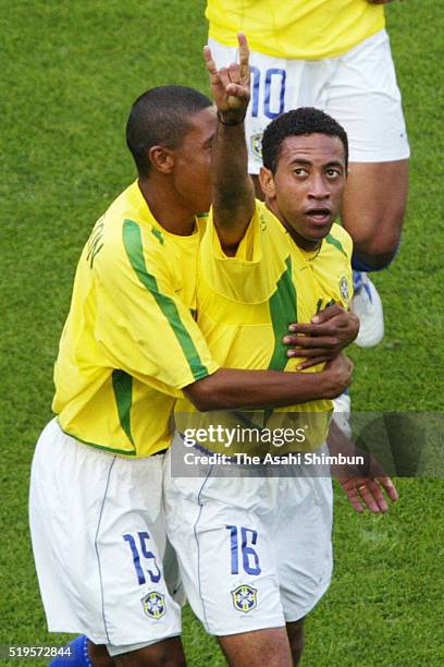 Junior of Brazil celebrates scoring his team's fifth goal with his team mate Kleberson during the FIFA World Cup Korea/Japan Group C match between...