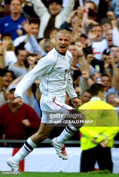 England's David Beckham celebrates in front of the crowd after scoring an injury-time equaliser against Greece during the World Cup qualifying match...
