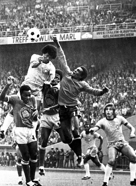Goalkeeper Muamba Kazadi from Zaire punches the ball away from Brazilian forward Janrzinho 22 June 1974 in Gelsenkirchen during the World Cup first...
