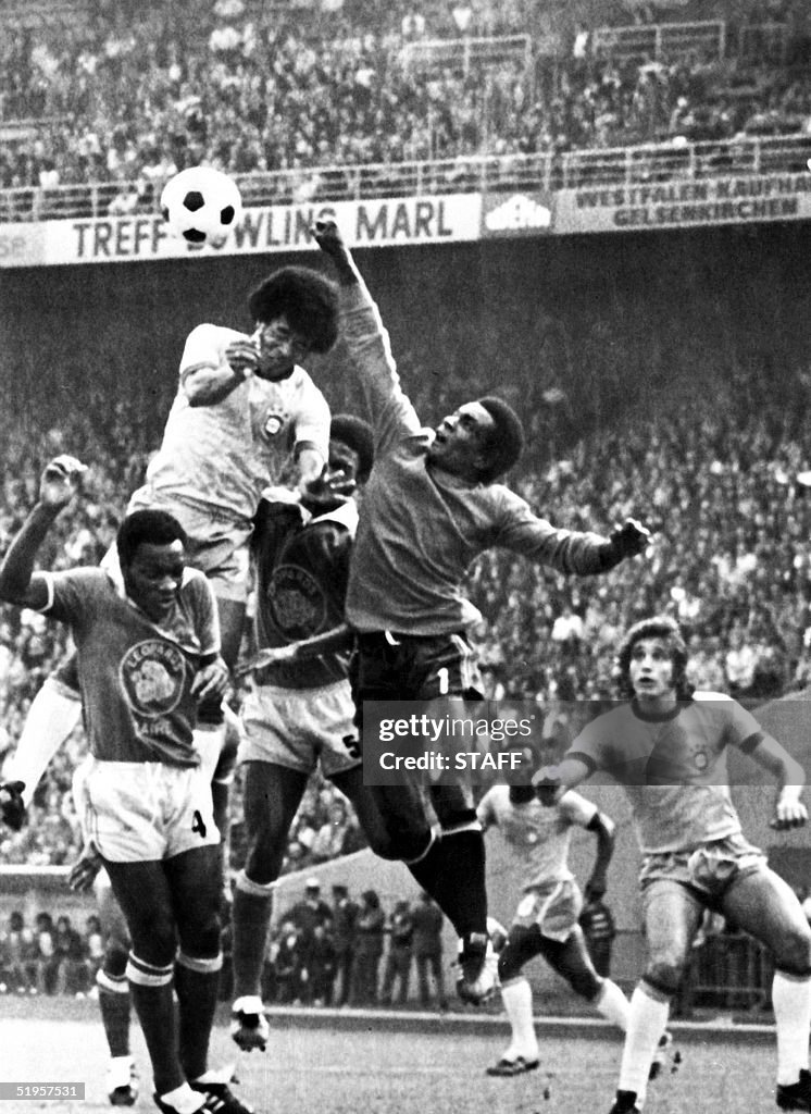 Goalkeeper Muamba Kazadi from Zaire (C) punches th