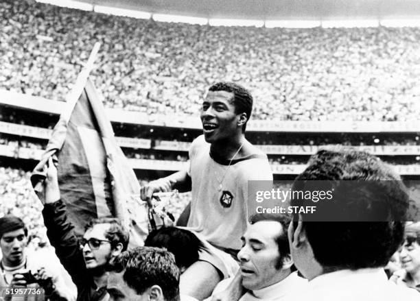 Brazilian forward Jairzinho is carried by fans after Brazil defeated Italy 4-1 in the World Cup final 21 June 1970 in Mexico City. It is Brazil's...