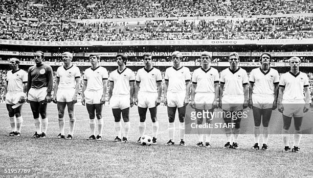The West German national soccer team lines up during the national anthem before the start of its World Cup soccer match for third place against...