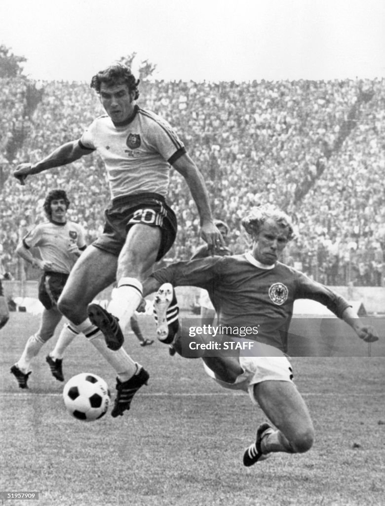 West German defender Berti Vogts (R) tackles Austr