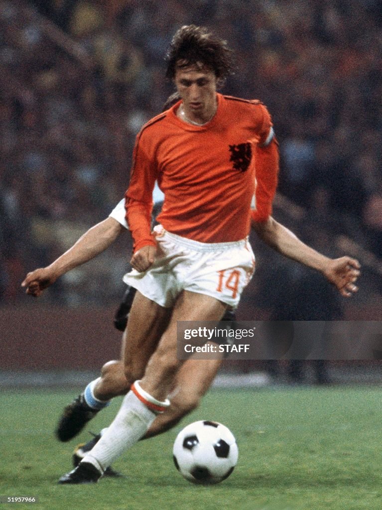 Dutch forward Johan Cruyff controls the ball under