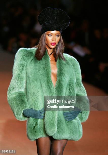 Model Naomi Campbell presents a creation from the Louis Vuitton News  Photo - Getty Images