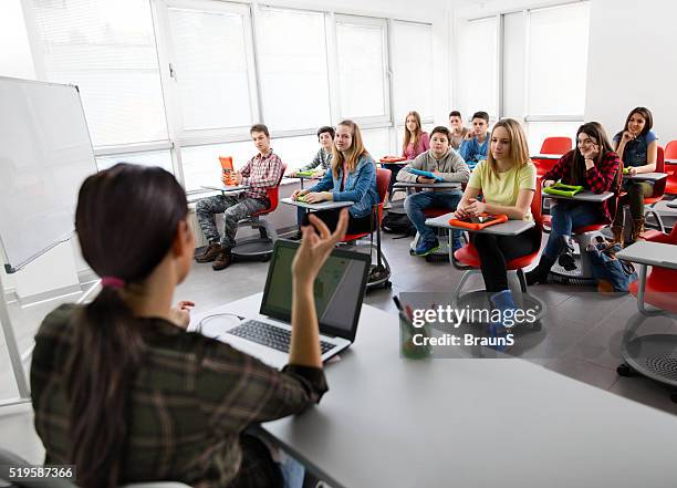 large group of high school students attending a modern class. - teacher taking attendance stock pictures, royalty-free photos & images